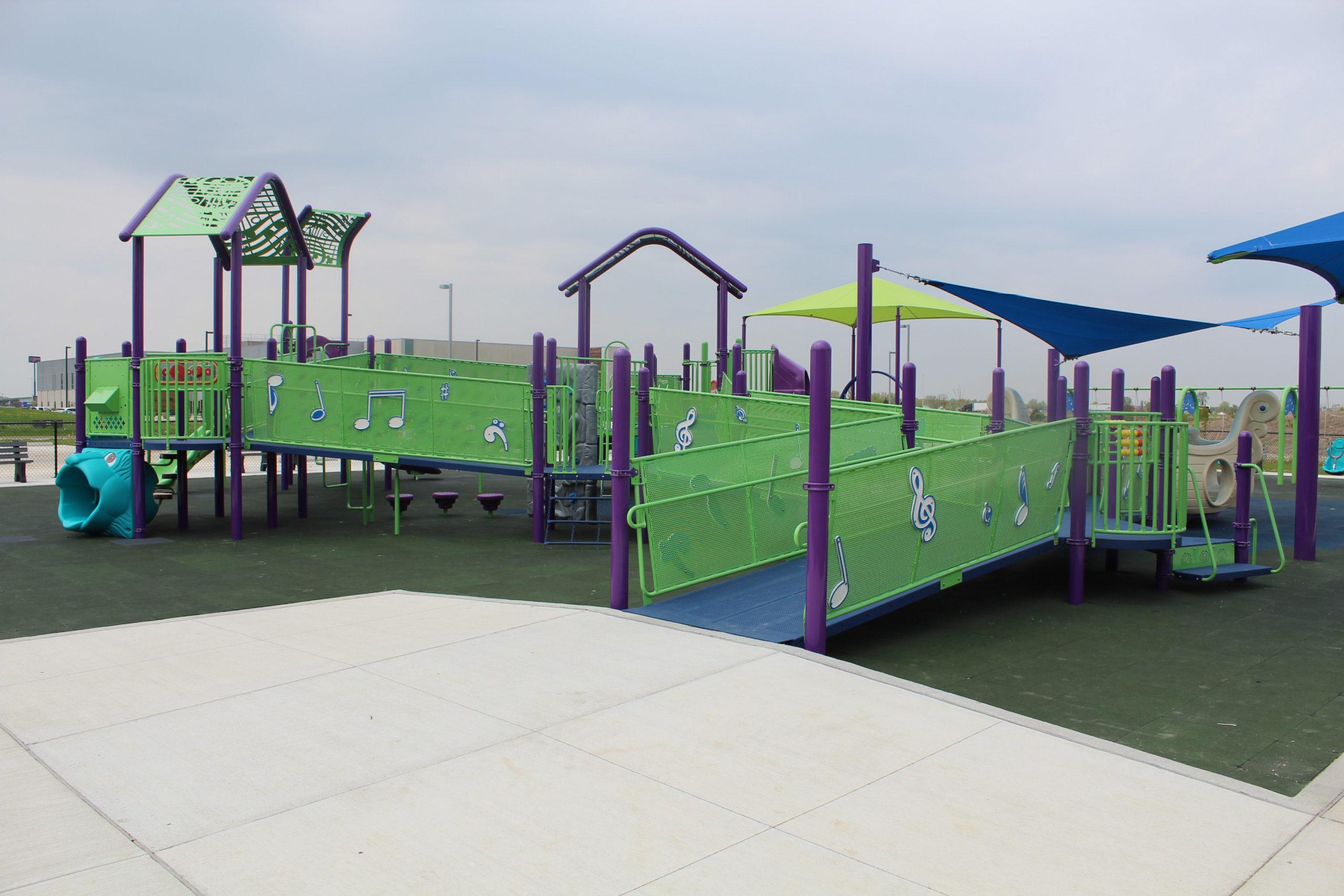 Children Playing On Playground In City Park Engaged In Football